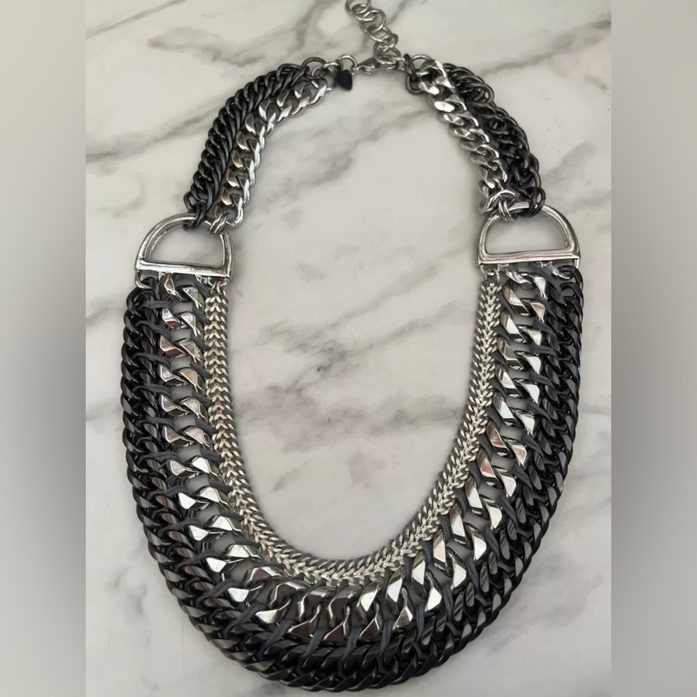 Polished silver and darker metallic tones multiple chain necklace